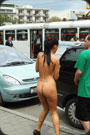 Nude girl in public street.